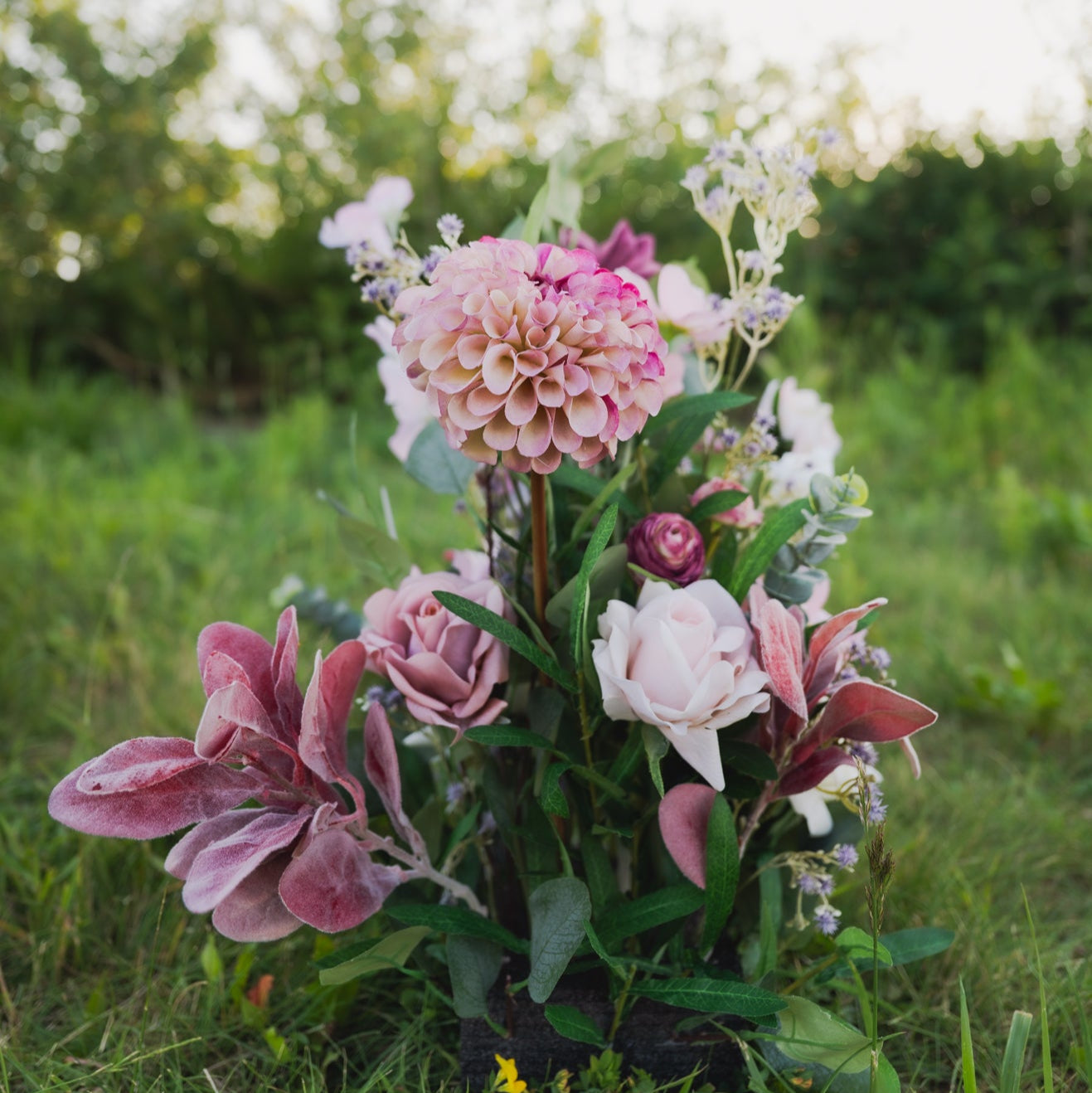 Plum Bliss Floor Florals. Bouquet of pink and white flowers on a grassy background