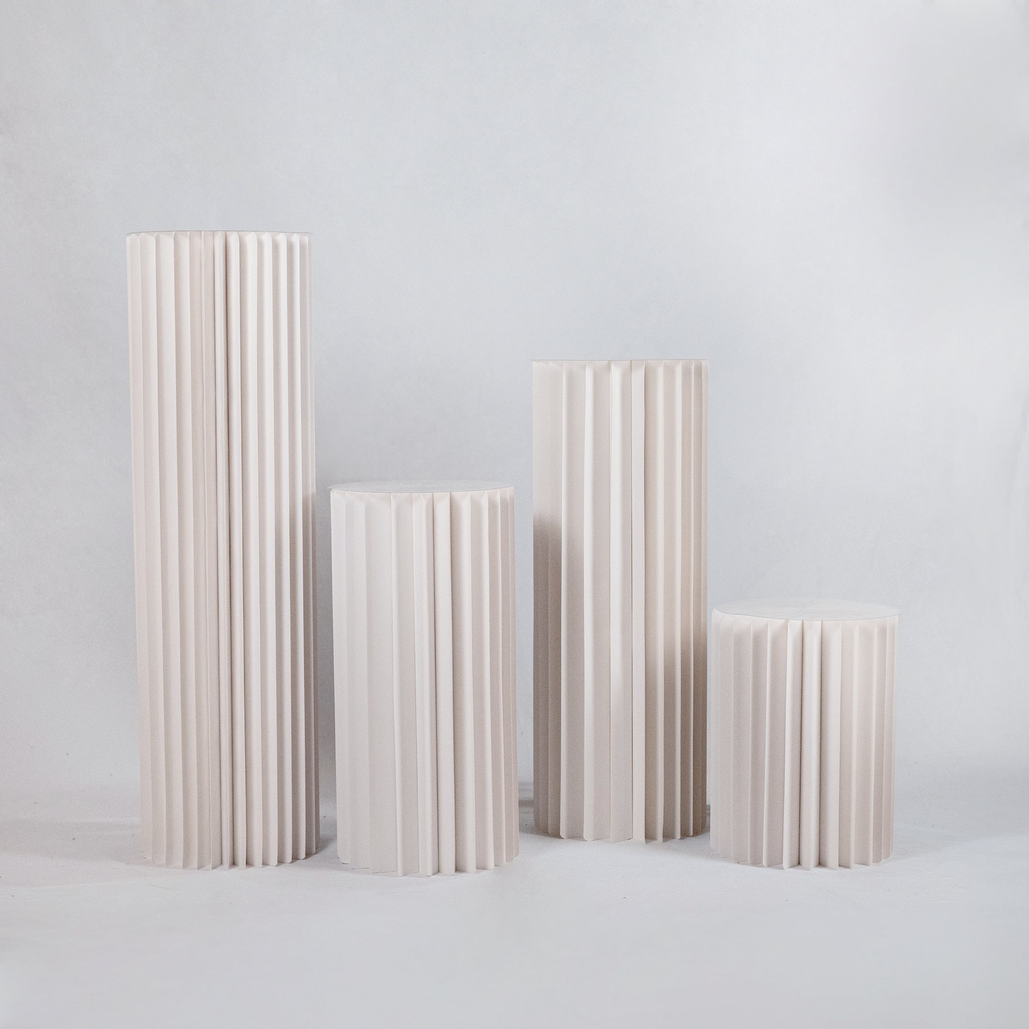 Set of Four White Cylindrical Pedestal Stand