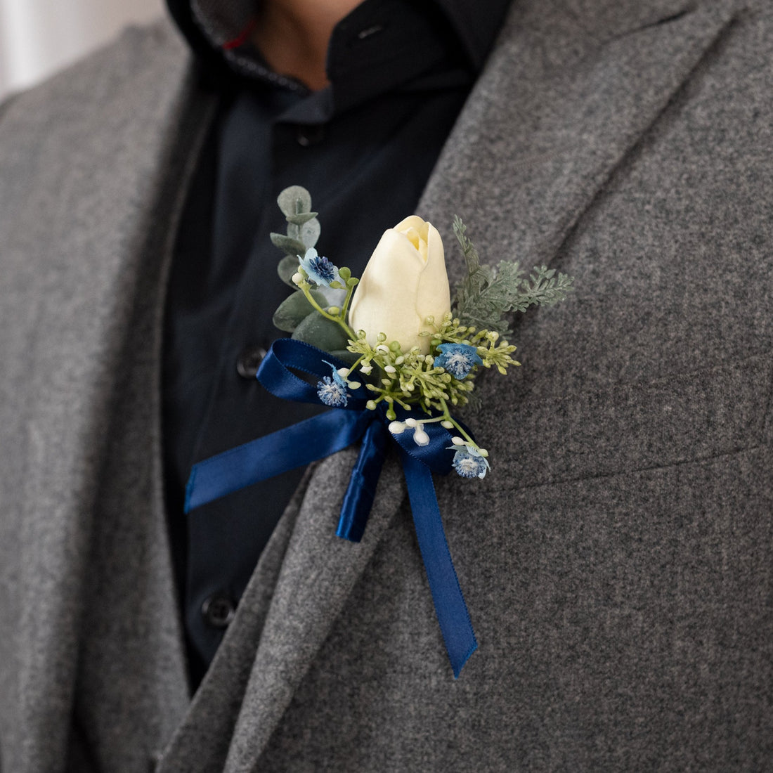 Tranquil tulip boutonniere
