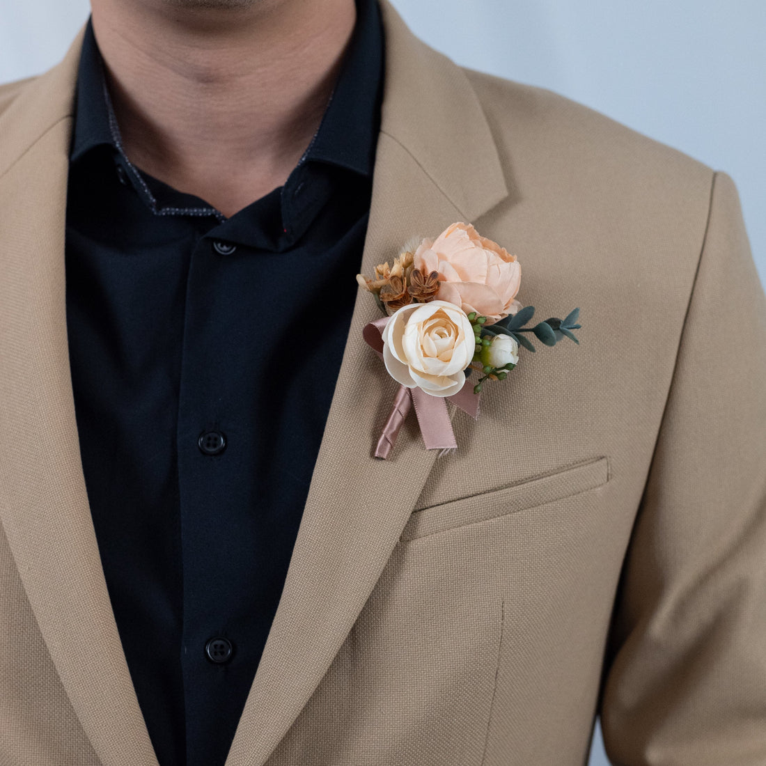 Soft sunrise peony boutonniere