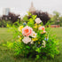 Close up shot of a Wildest Dreams floor floral arrangement (aisle marker) with a blurred background near the Alberta Legislature building. 
