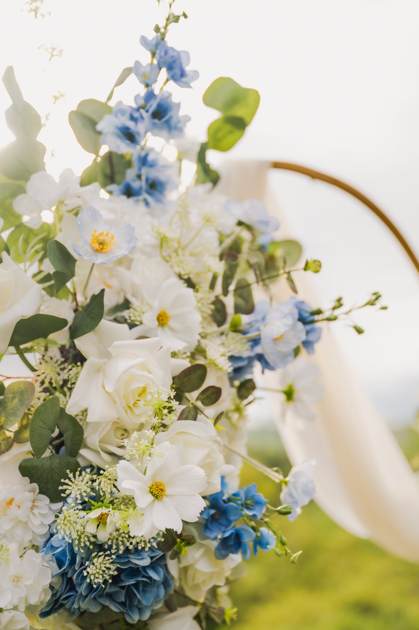 Close up of the Ocean Breeze arch flowers with green leaves on a blurred background