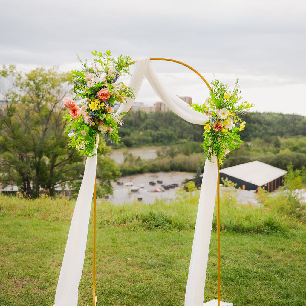 The Wildest Dreams two-piece arch faux (artificial, silk, and real touch) flowers on an arch frame.
