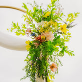 Close up of one of our Wildest Dreams two-piece arch faux (artificial) flowers on an arch frame.