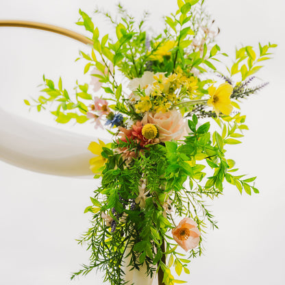 Close up of one of our Wildest Dreams two-piece arch faux (artificial) flowers on an arch frame.