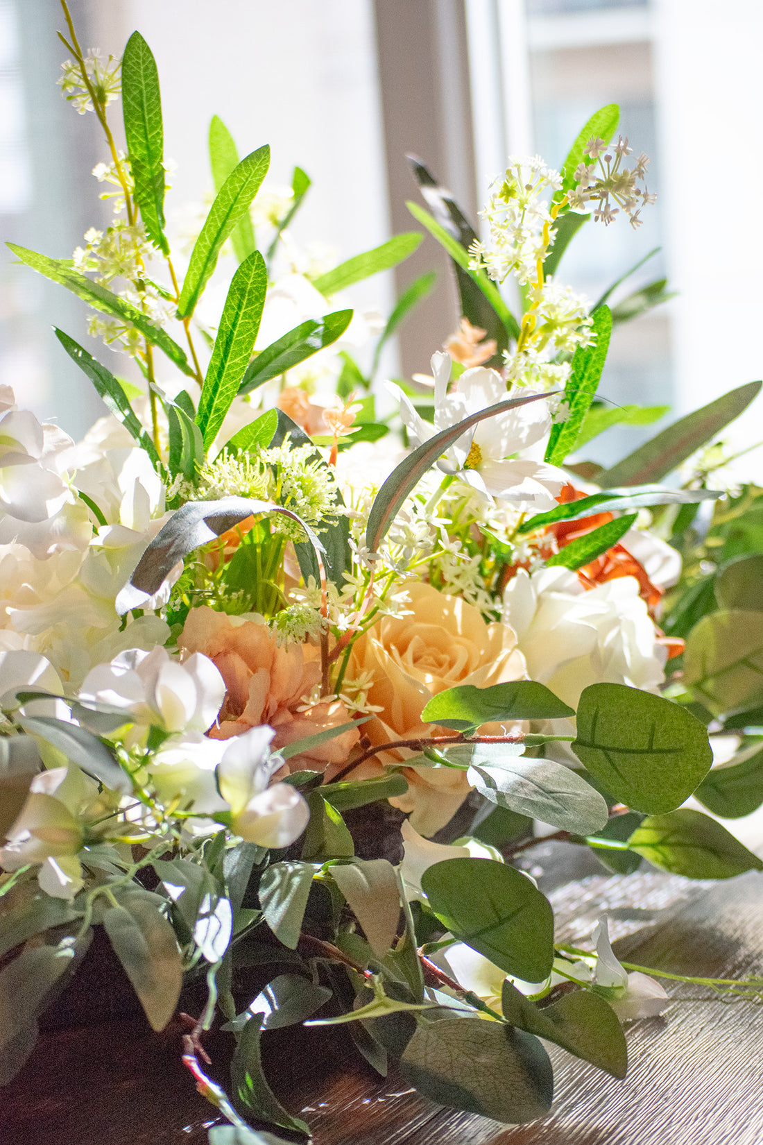 Close up of the Cocoa Bloom floral arrangements for aisle markers.